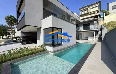 Imagem: A casa em condomínio possui 5 Dormitórios, 5 Banheiros, 4