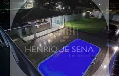 Imagem: A casa possui 3 Dormitórios, 4 Banheiros, 5 Vagas na garagem