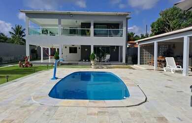 Imagem: A casa possui 5 Dormitórios, 2 Banheiros, 5 Vagas na garagem