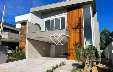 Imagem: A casa possui 3 Dormitórios, 4 Banheiros, 4 Vagas na garagem