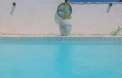 Imagem: A casa possui 4 Dormitórios, 3 Banheiros, 4 Vagas na garagem