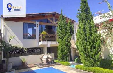 Imagem: A casa possui 3 Dormitórios, 5 Banheiros, 2 Vagas na garagem