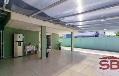 Imagem: A casa possui 4 Dormitórios, 4 Banheiros, 3 Vagas na garagem