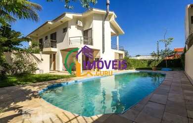 Imagem: A casa possui 5 Dormitórios, 5 Banheiros, 5 Vagas na garagem