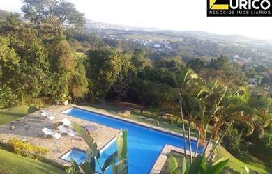 Imagem: A casa possui 4 Dormitórios, 4 Banheiros, 5 Vagas na garagem