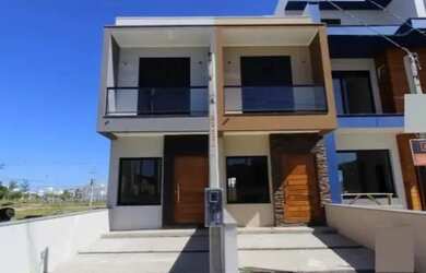 Imagem: A casa possui 2 Dormitórios, 3 Banheiros, 1 Vaga na garagem