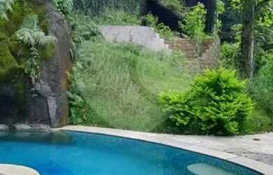 Imagem: A casa possui 5 Dormitórios, 5 Banheiros, 5 Vagas na garagem