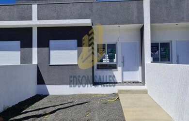 Imagem: A casa possui 2 Dormitórios, 1 Banheiro, 3 Vagas na garagem