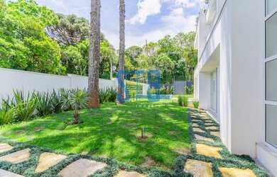 Imagem: A casa possui 4 Dormitórios, 5 Banheiros, 5 Vagas na garagem