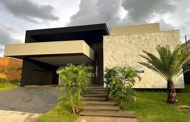 Imagem: A casa possui 4 Dormitórios, 5 Banheiros, 3 Vagas na garagem