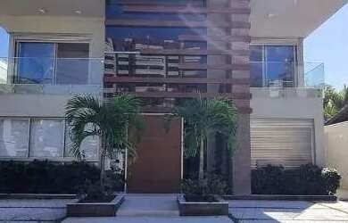 Imagem: A casa possui 5 Dormitórios, 5 Banheiros, 4 Vagas na garagem