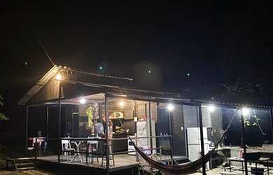 Imagem: A casa possui 2 Dormitórios, 3 Vagas na garagem e está localizado