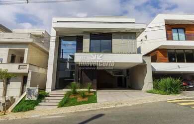 Imagem: A casa possui 4 Dormitórios, 5 Banheiros, 2 Vagas na garagem