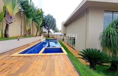 Imagem: A casa possui 5 Dormitórios, 5 Banheiros, 5 Vagas na garagem