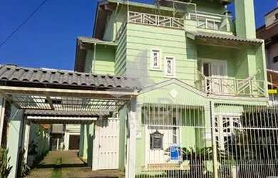 Imagem: A casa possui 4 Dormitórios, 4 Banheiros, 5 Vagas na garagem