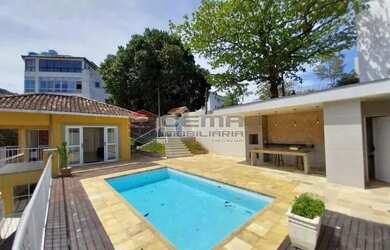 Imagem: A casa para alugar possui 4 Dormitórios, 5 Banheiros, 2 Vagas