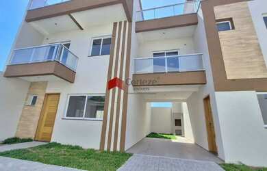 Imagem: A casa possui 3 Dormitórios, 3 Banheiros, 2 Vagas na garagem