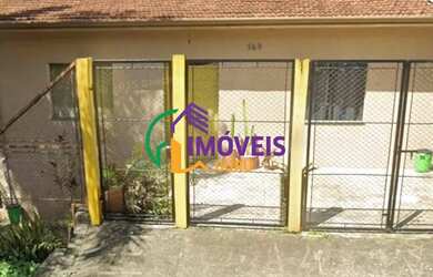 Imagem: A casa possui 2 Dormitórios, 2 Banheiros, 2 Vagas na garagem