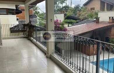 Imagem: A casa possui 5 Dormitórios, 5 Banheiros, 4 Vagas na garagem