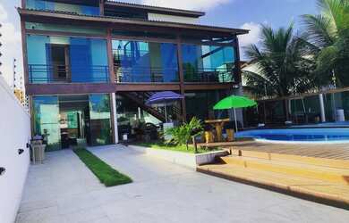 Imagem: A casa possui 5 Dormitórios, 5 Vagas na garagem e está localizado