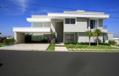 Imagem: A casa em condomínio possui 4 Dormitórios, 3 Vagas na garagem