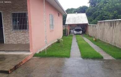 Imagem: A casa possui 2 Dormitórios, 3 Banheiros, 4 Vagas na garagem