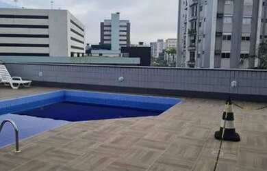 Imagem: O apartamento possui 1 Dormitório, 1 Banheiro, 1 Vaga na garagem