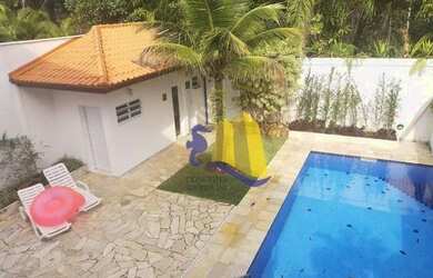 Imagem: A casa possui 4 Dormitórios, 5 Banheiros, 3 Vagas na garagem