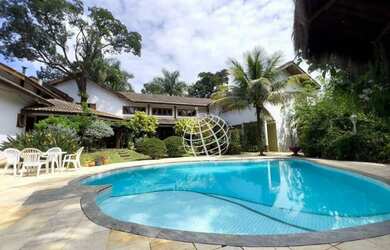 Imagem: A casa possui 5 Dormitórios, 5 Banheiros, 5 Vagas na garagem