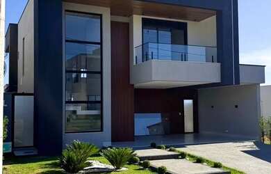 Imagem: A casa possui 4 Dormitórios, 5 Banheiros, 4 Vagas na garagem