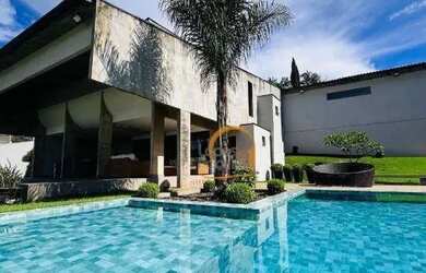 Imagem: A casa possui 3 Dormitórios, 5 Banheiros, 5 Vagas na garagem