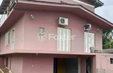 Imagem: A casa possui 3 Dormitórios, 1 Banheiro, 2 Vagas na garagem