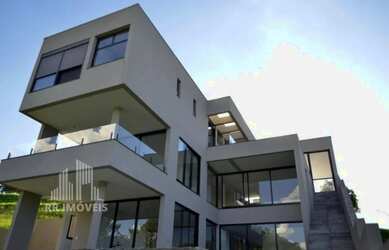 Imagem: A casa em condomínio possui 4 Dormitórios, 5 Banheiros, 4