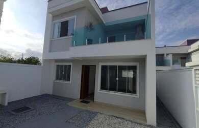 Imagem: A casa possui 3 Dormitórios, 3 Banheiros, 2 Vagas na garagem