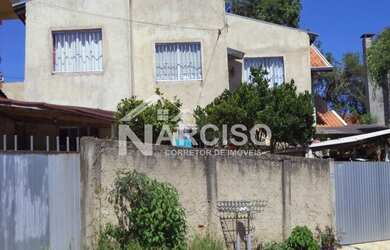 Imagem: A casa possui 5 Dormitórios, 2 Banheiros, 2 Vagas na garagem