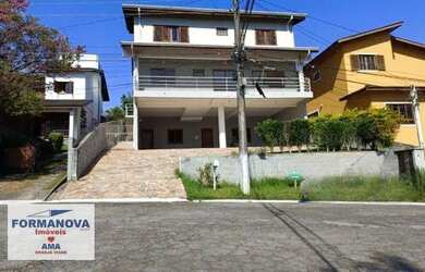 Imagem: A casa em condomínio possui 5 Dormitórios, 5 Banheiros, 5