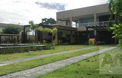 Imagem: A casa possui 4 Dormitórios, 5 Banheiros, 4 Vagas na garagem