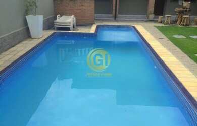 Imagem: A casa possui 3 Dormitórios, 3 Banheiros, 4 Vagas na garagem