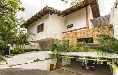 Imagem: A casa possui 5 Dormitórios, 5 Banheiros, 5 Vagas na garagem