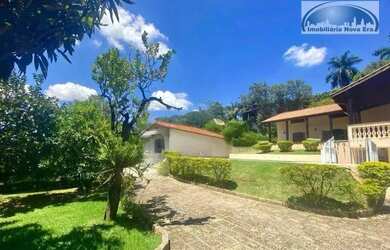 Imagem: A casa em condomínio possui 5 Dormitórios, 5 Banheiros, 4