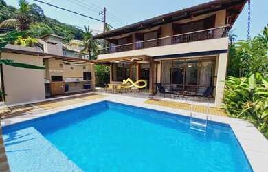 Imagem: A casa possui 5 Dormitórios, 5 Banheiros, 2 Vagas na garagem