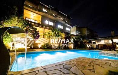 Imagem: A casa em condomínio possui 4 Dormitórios, 5 Banheiros, 4