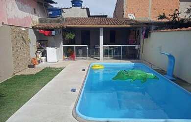 Imagem: A casa possui 3 Dormitórios e está localizado em Praia de