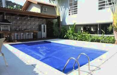 Imagem: A casa possui 5 Dormitórios, 5 Banheiros, 4 Vagas na garagem