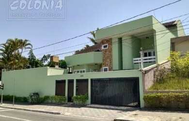 Imagem: A casa possui 3 Dormitórios, 5 Banheiros, 5 Vagas na garagem