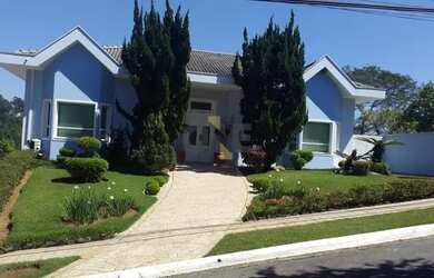 Imagem: A casa possui 4 Dormitórios, 5 Banheiros, 5 Vagas na garagem