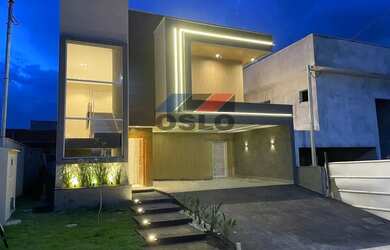 Imagem: A casa possui 4 Dormitórios, 5 Banheiros, 4 Vagas na garagem