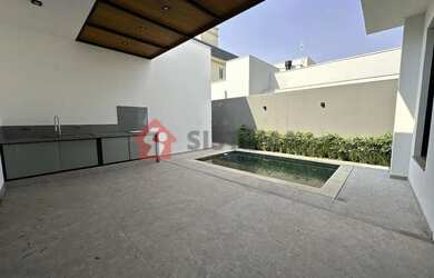 Imagem: A casa possui 4 Dormitórios, 5 Banheiros, 2 Vagas na garagem