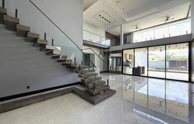 Imagem: A casa possui 4 Dormitórios, 5 Banheiros, 5 Vagas na garagem