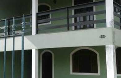 Imagem: A casa possui 2 Dormitórios, 4 Vagas na garagem e está localizado